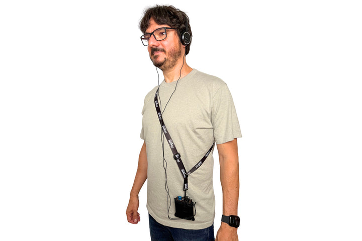 Sound mixer wearing the Viviana IFB pouch across the chest on the included Viviana shoulder strap